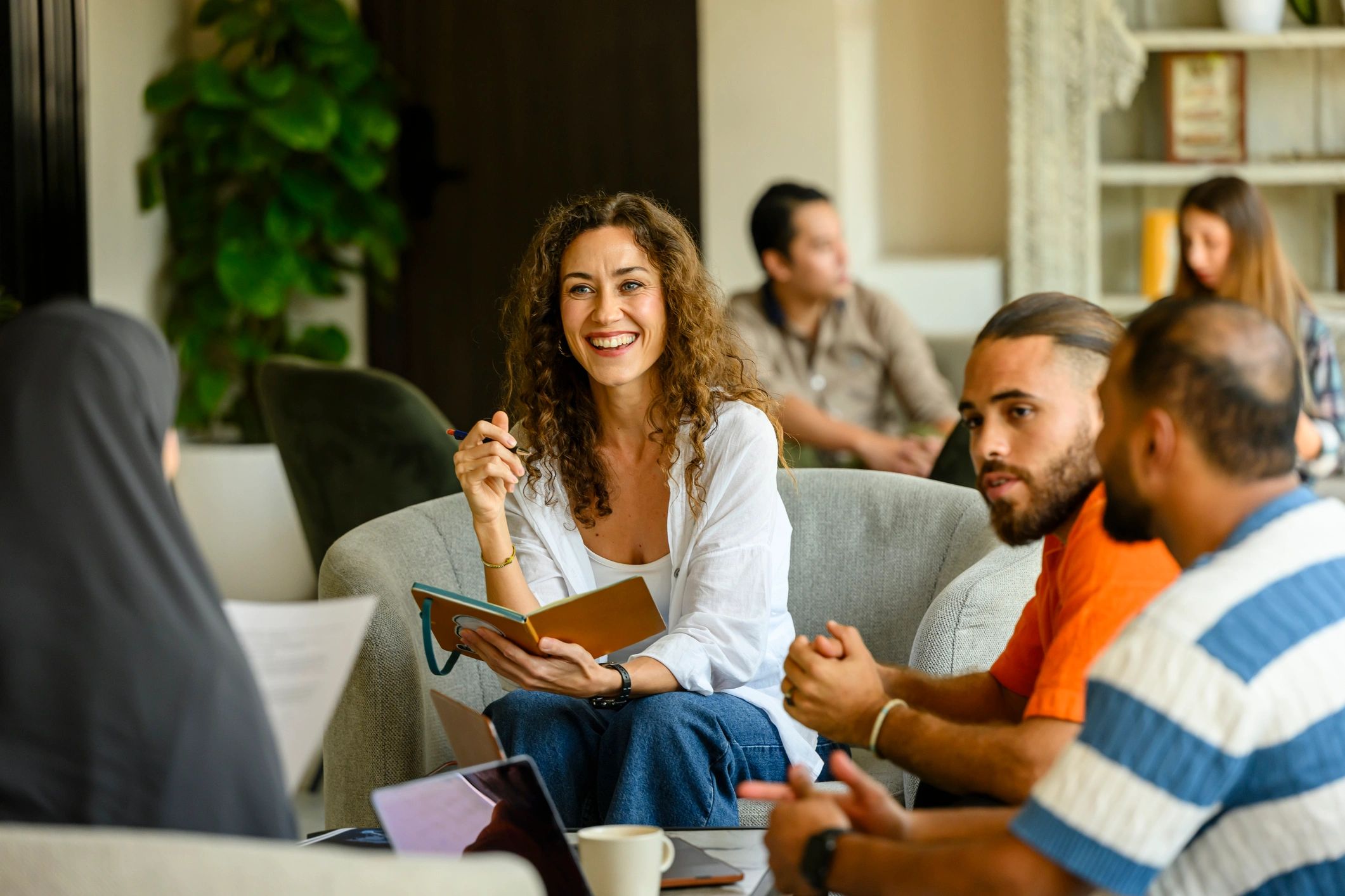 Business team meeting and collaborating around a table